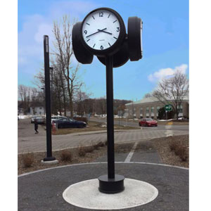 Four dial moderne street clock with a simple design, suitable for use in train stations or residences