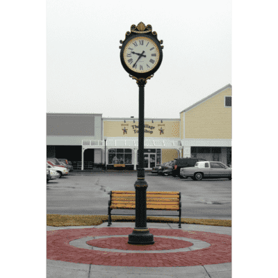Two dial street clock with a cast aluminum crown and detailed ornamentation on both the clock head and post.