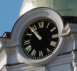Smalted Tower Clock Dial with gold leafed dial markings mounted on a Municipal Building Tower 