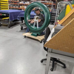 Technician working on Almy’s Clock restoration in the workshop.