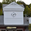 LED halo-lighted outdoor clock with Roman numerals at the Shops at Putterham, Chestnut Hill MA. Backlighted aluminum hands and numerals with polyurethane and clear coat finish - Day Shot