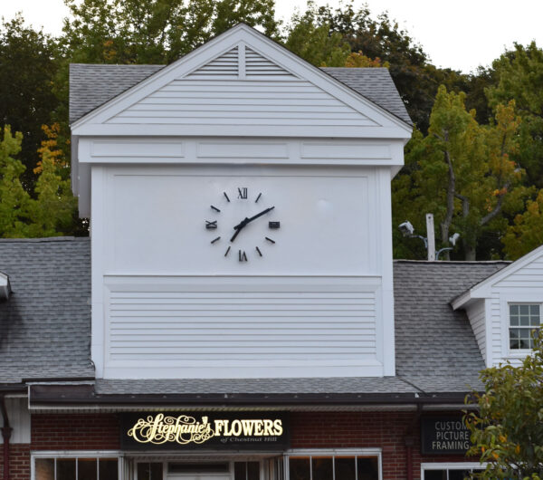 LED halo-lighted outdoor clock with Roman numerals at the Shops at Putterham, Chestnut Hill MA. Backlighted aluminum hands and numerals with polyurethane and clear coat finish - Day Shot